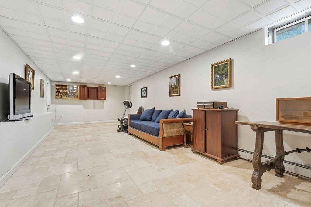 57 Douglas Road Needham, MA 02492 - Photo 20 of 22 a living room with furniture and a flat screen tv