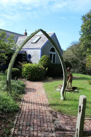 a front view of a house with garden
