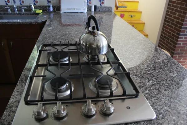 a view of a dining room with furniture large windows and wooden floor