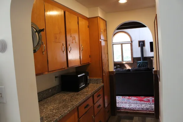 a living room with furniture and a mirror