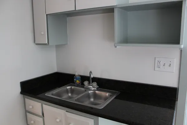 a view of a brick house with a large windows