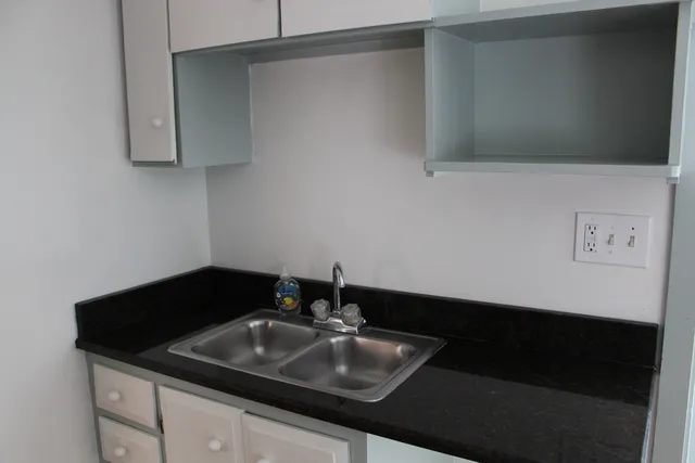 a view of a brick house with a large windows