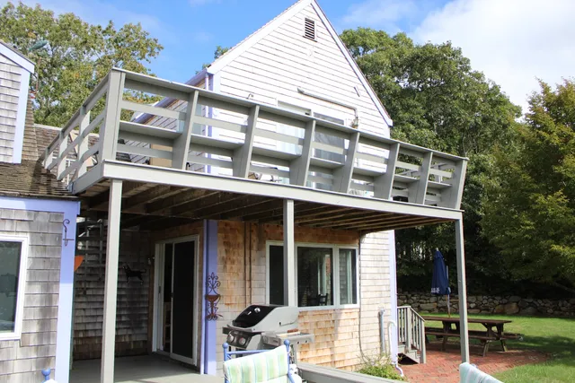 a bedroom with a bed and a television