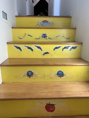 a bathroom with a granite countertop sink a toilet and mirror