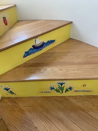 a view of staircase with wooden floor