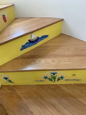 a view of staircase with wooden floor