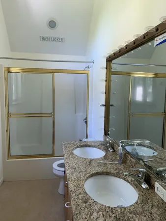 a view of a balcony with wooden floor and fence