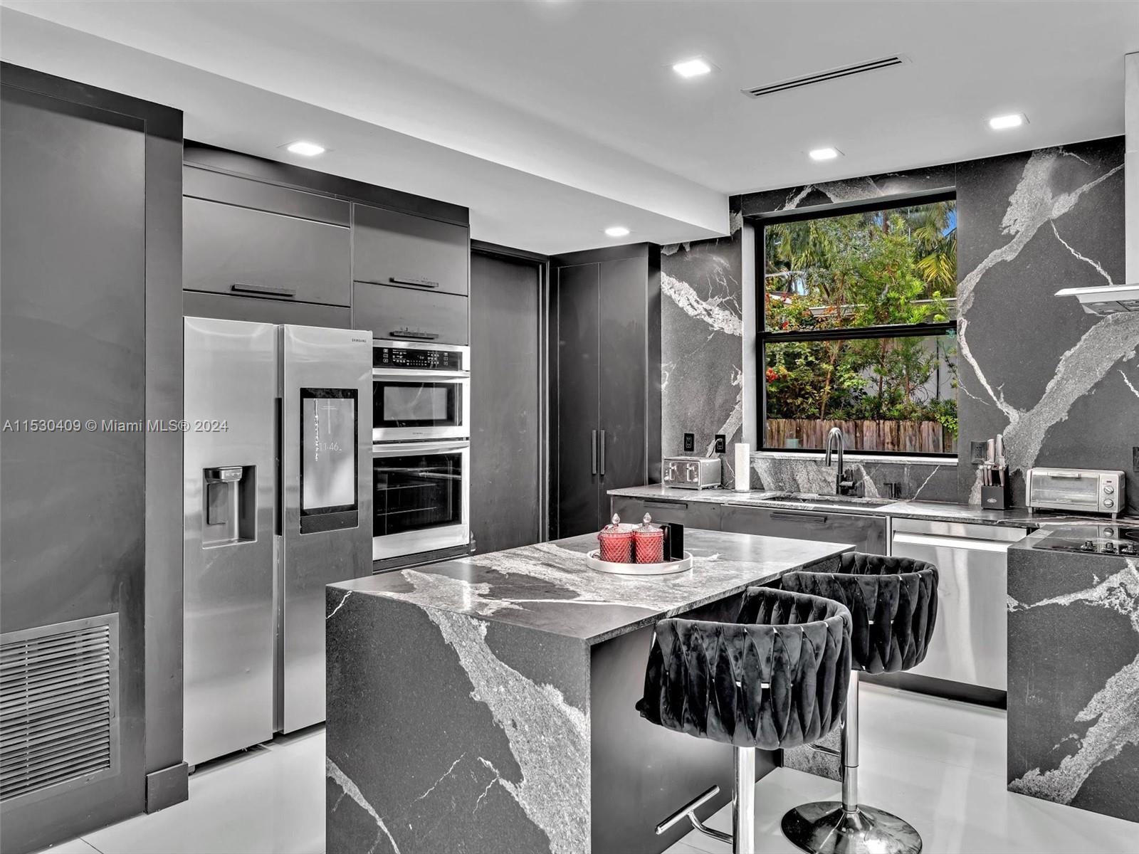3010 Alton Road Miami Beach, FL 33140 - Photo 12 of 41 a view of a dining room with furniture window and outside view