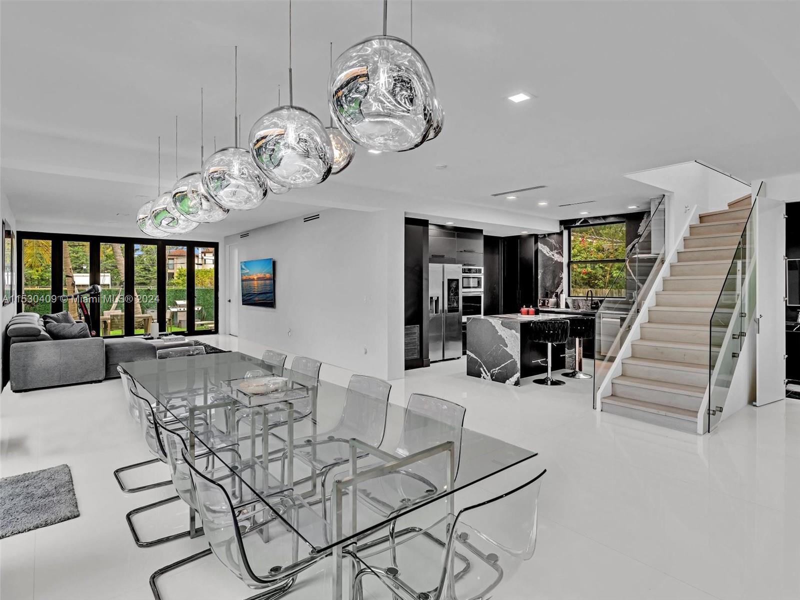 3010 Alton Road Miami Beach, FL 33140 - Photo 2 of 41 a view of a livingroom and dining room