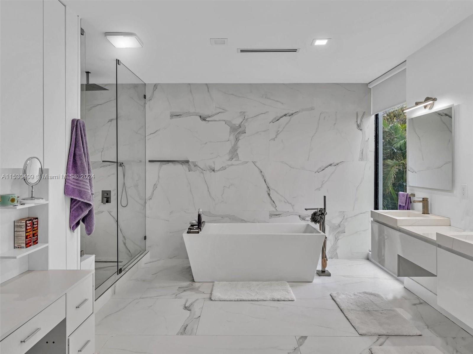 3010 Alton Road Miami Beach, FL 33140 - Photo 25 of 41 a bathroom with a tub a sink and a shower