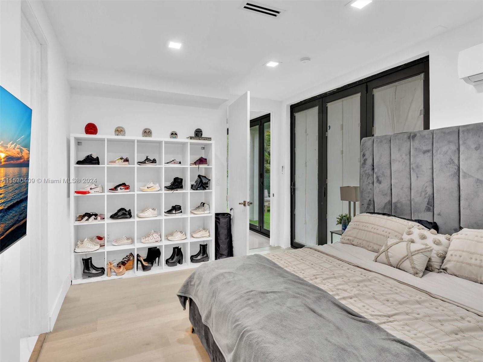 3010 Alton Road Miami Beach, FL 33140 - Photo 33 of 41 a bedroom with a bed and a window