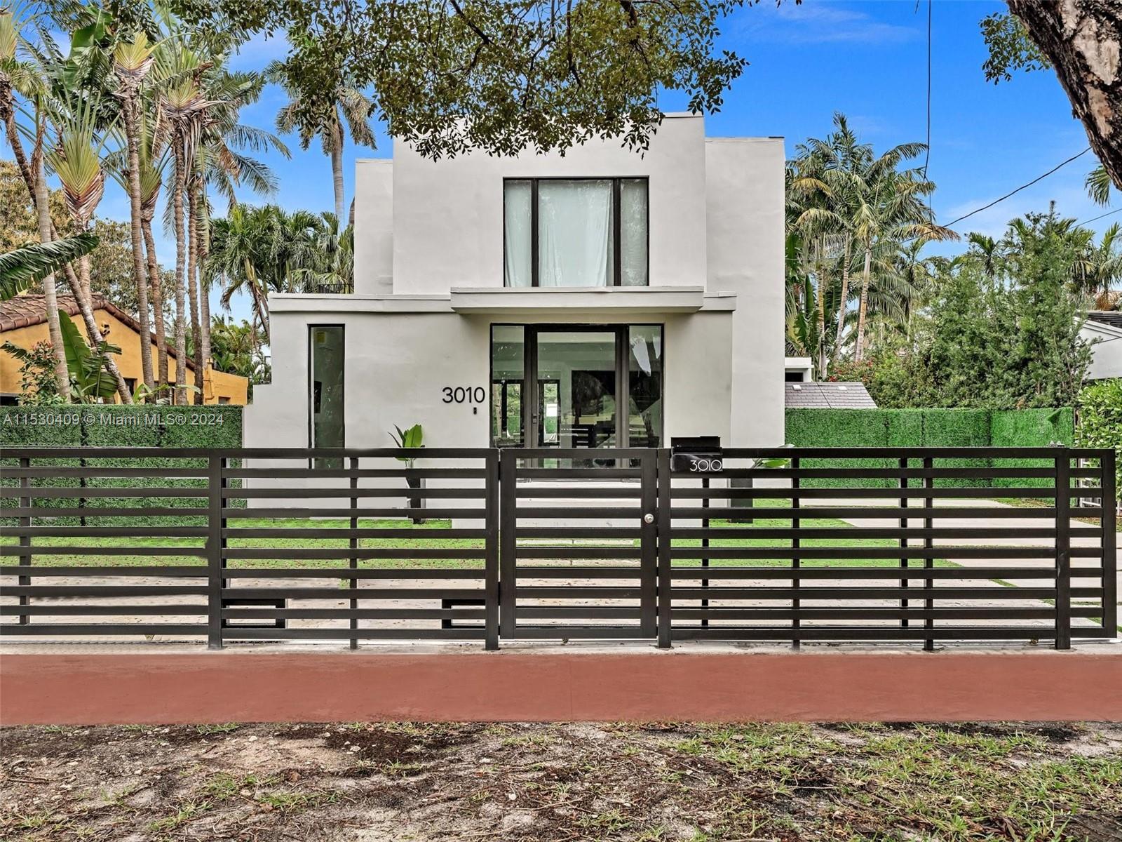 3010 Alton Road Miami Beach, FL 33140 - Photo 36 of 41 a view of a house with a street