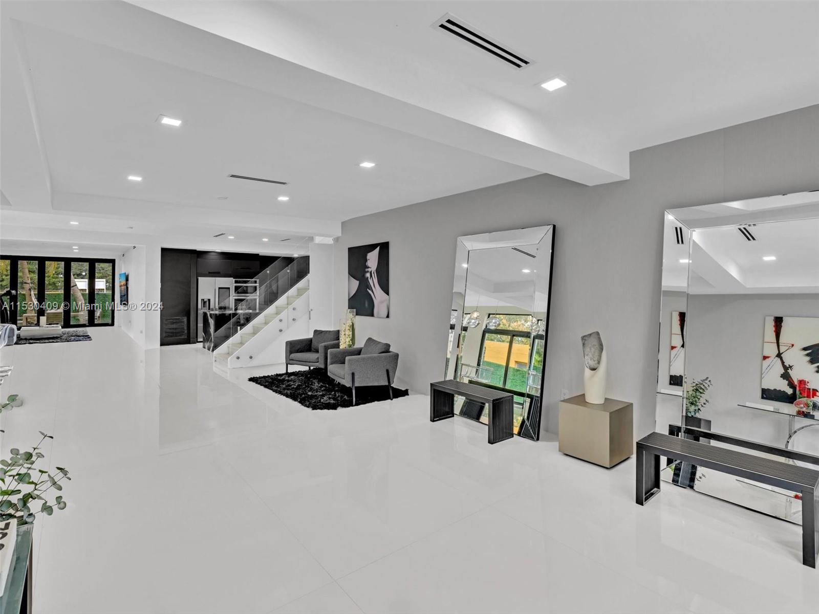 3010 Alton Road Miami Beach, FL 33140 - Photo 7 of 41 a living room with furniture and a wooden floor