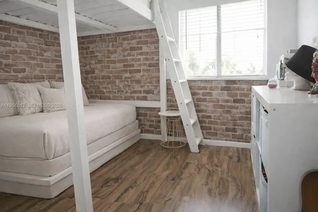 a living room with a couch and a stove top oven