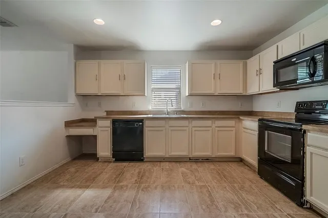 a kitchen with stainless steel appliances granite countertop a stove and a sink