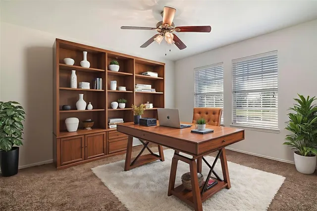 a workspace with furniture and window