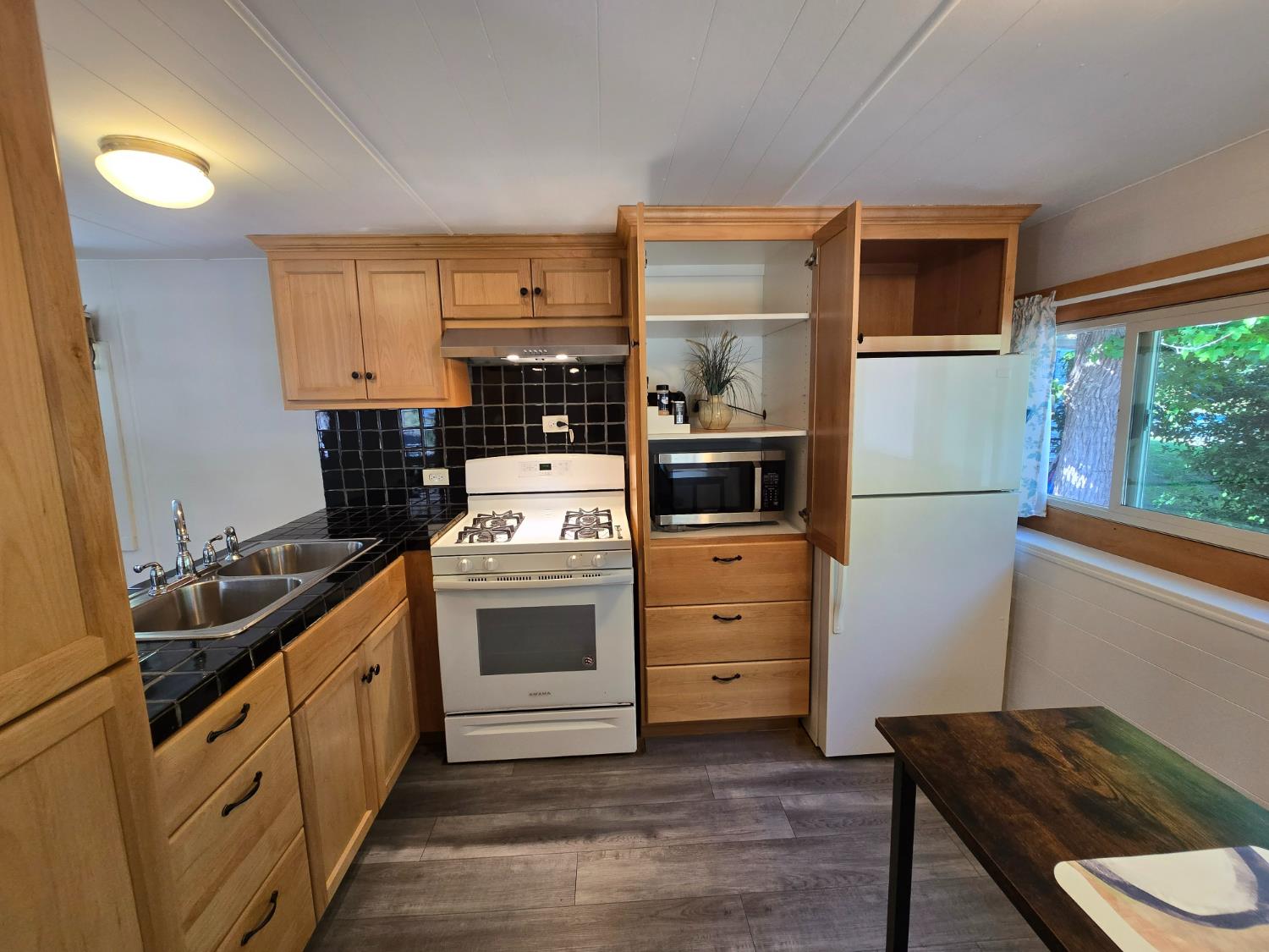 1525 Cold Springs Road, Unit 16 Placerville, CA 95667 - Photo 10 of 38 All cabinets are self closing. Microwave provided is hidden in pantry closet. Room on countertop for smaller unit