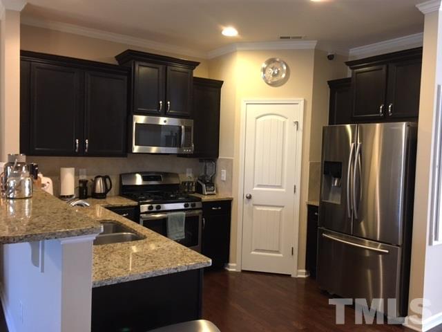 931 Ileagnes Road Raleigh, NC 27603 - Photo 6 of 23 Gorgeous granite and stainless appliances with gas stove!
