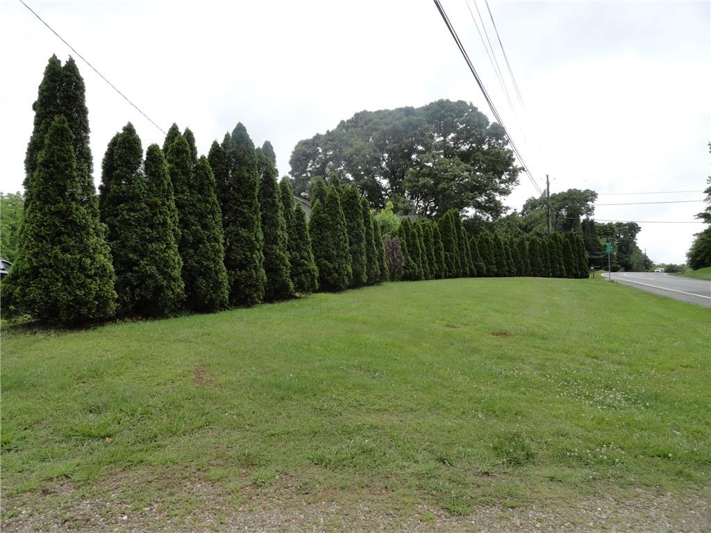 8664 Cumming Highway Canton, GA 30115 - Photo 2 of 18 a big yard with lots of green space