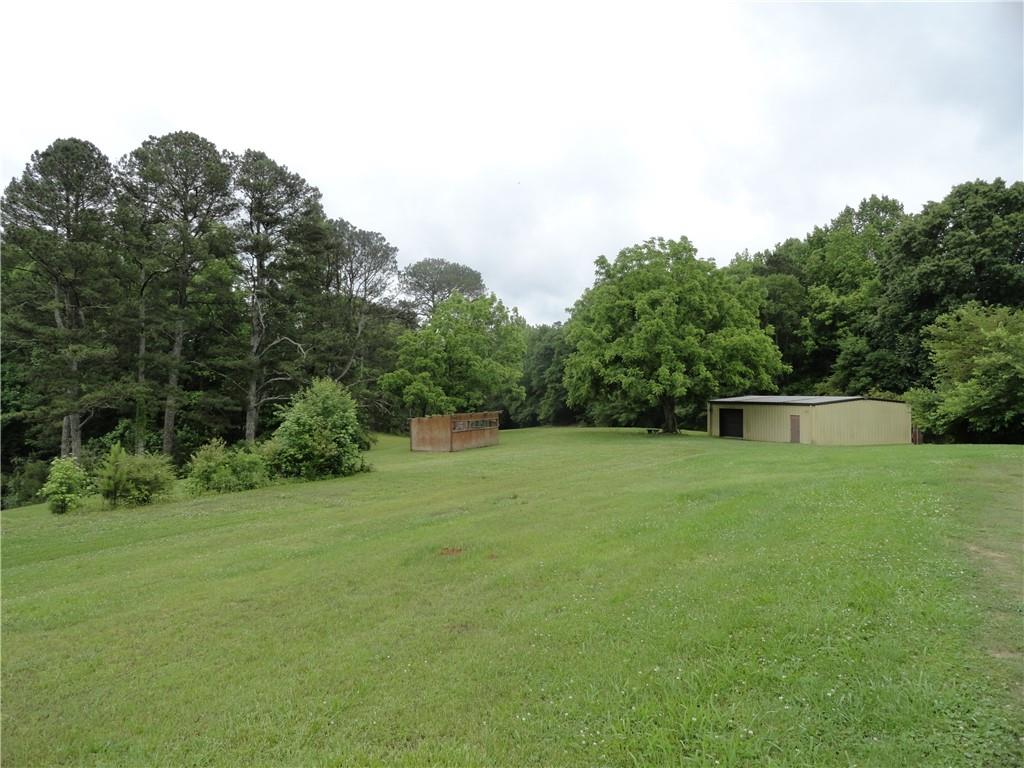 8664 Cumming Highway Canton, GA 30115 - Photo 3 of 18 a view of a backyard