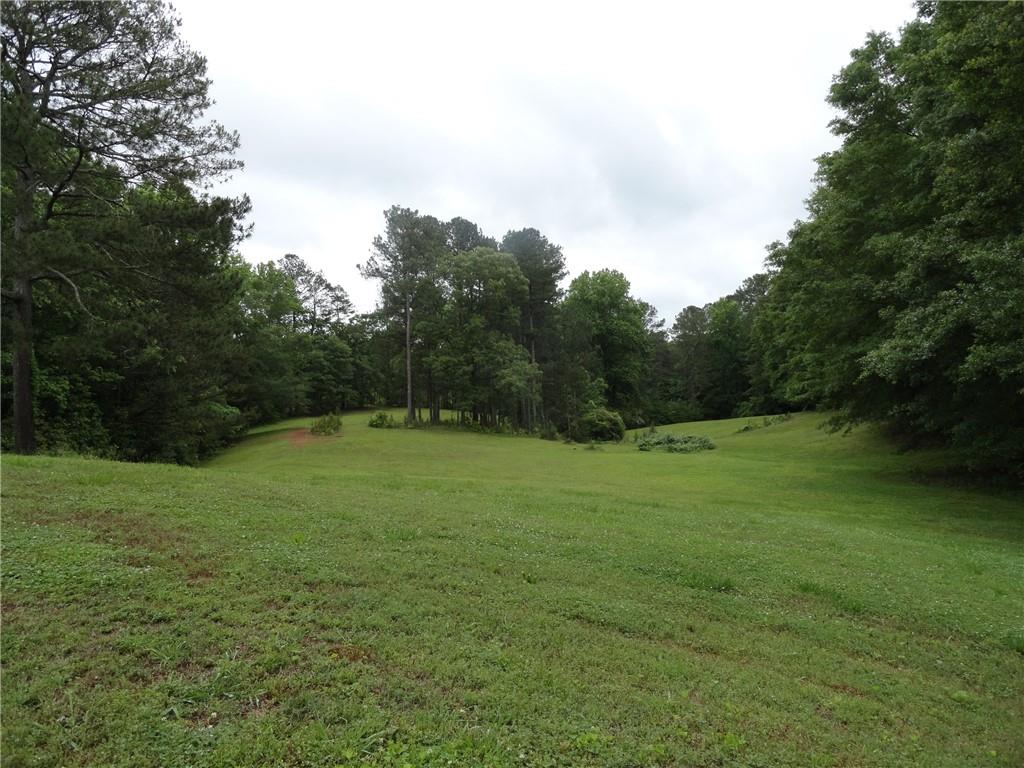 8664 Cumming Highway Canton, GA 30115 - Photo 7 of 18 a view of outdoor space and yard