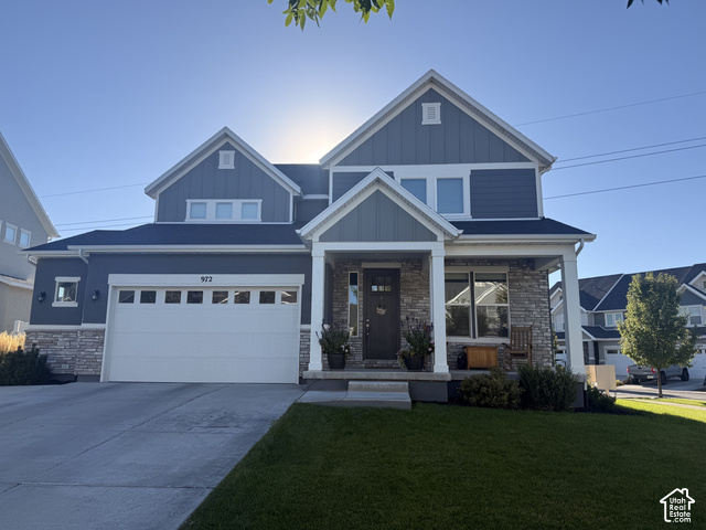 972 Vine Street Mapleton, UT 84664 - Photo 1 of 40 Two-story facade with stone and siding accents, prominent gabled rooflines, two-car garage with transom windows, covered front porch, and manicured lawn