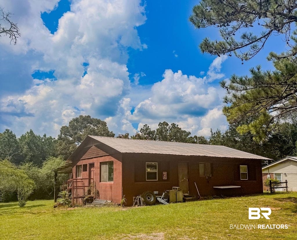1456 Allen Walker Road Grove Hill, AL 36451 - Photo 2 of 28 Front view of outbuilding with a yard