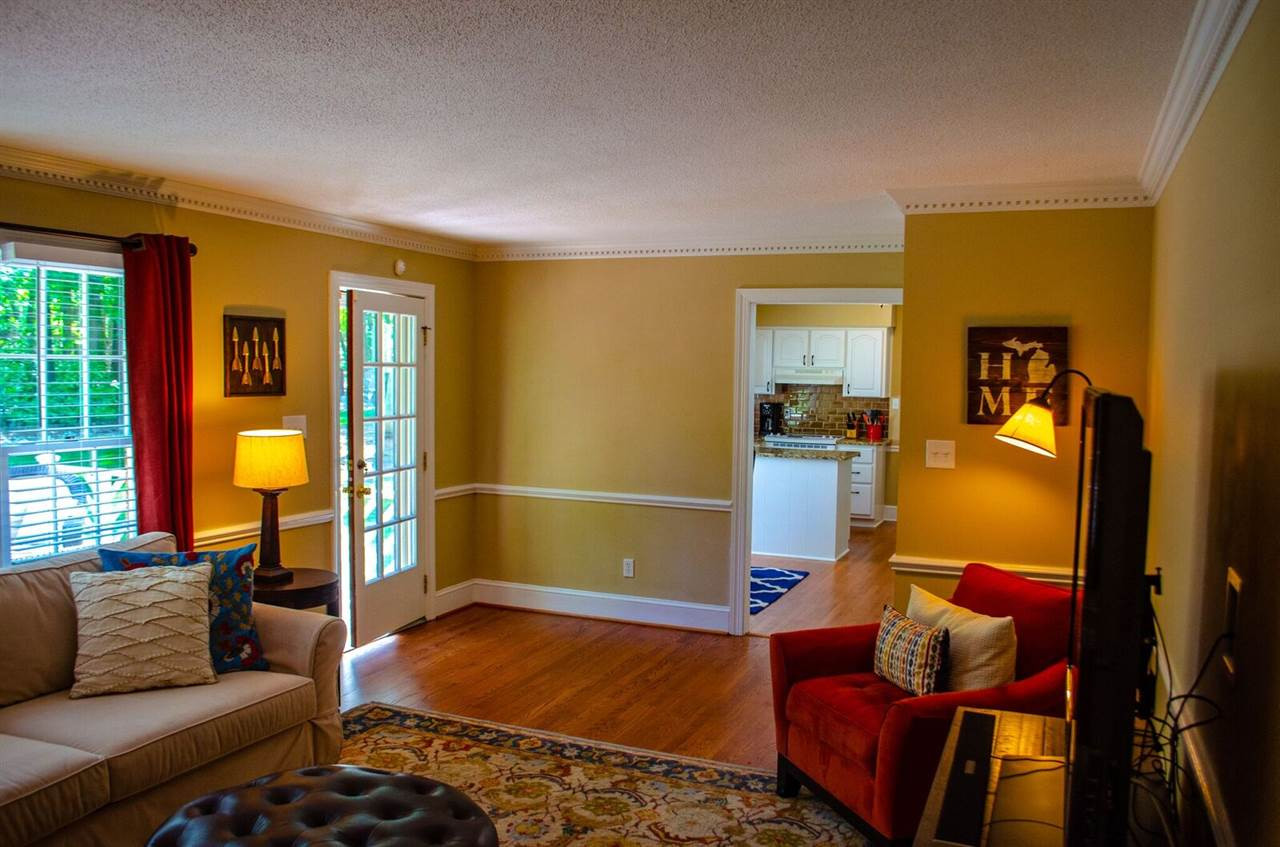 10016 Bushveld Lane Raleigh, NC 27613 - Photo 13 of 24 The family room is spacious, with a wood burning fireplace, and beautiful built ins. Family Room