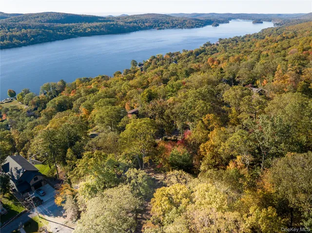 a large body of water with a building in the background