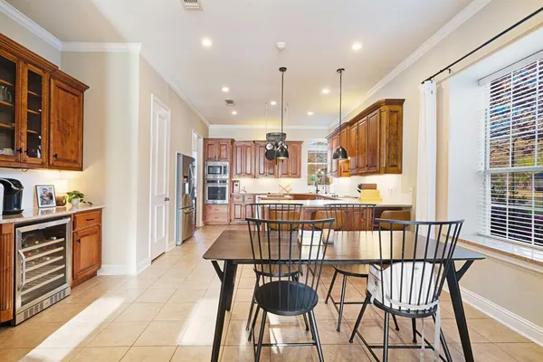 a kitchen with stainless steel appliances granite countertop a sink and cabinets