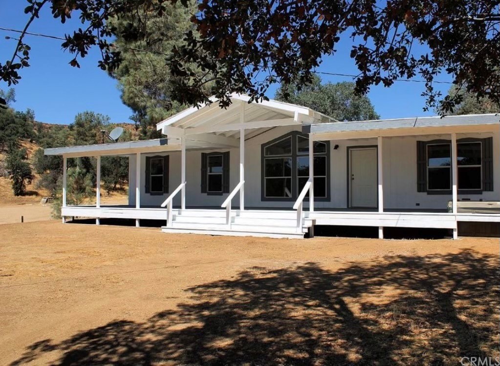 35351 Sand Canyon Road Caliente, CA 93518 - Photo 1 of 1 a view of a house with a swimming pool and a large tree