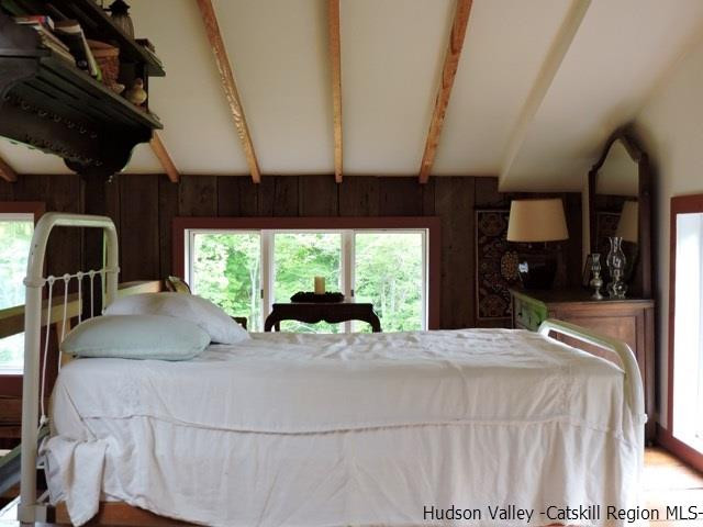146 West Settlement Road Roxbury, NY 12474 - Photo 25 of 35 a bed sitting in a bedroom next to a window