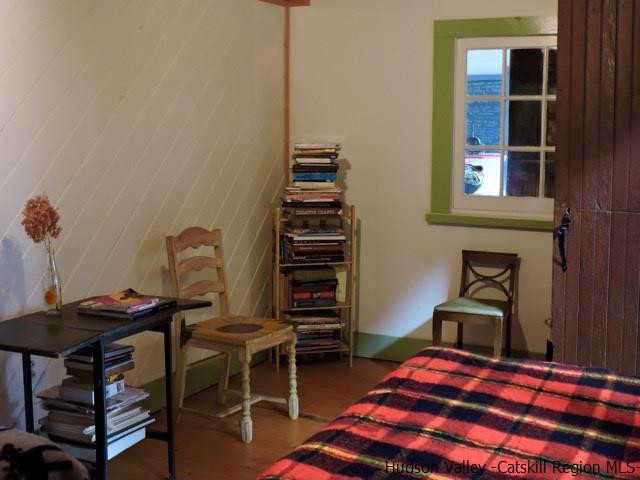 146 West Settlement Road Roxbury, NY 12474 - Photo 30 of 35 a bedroom with a bed and a chandelier