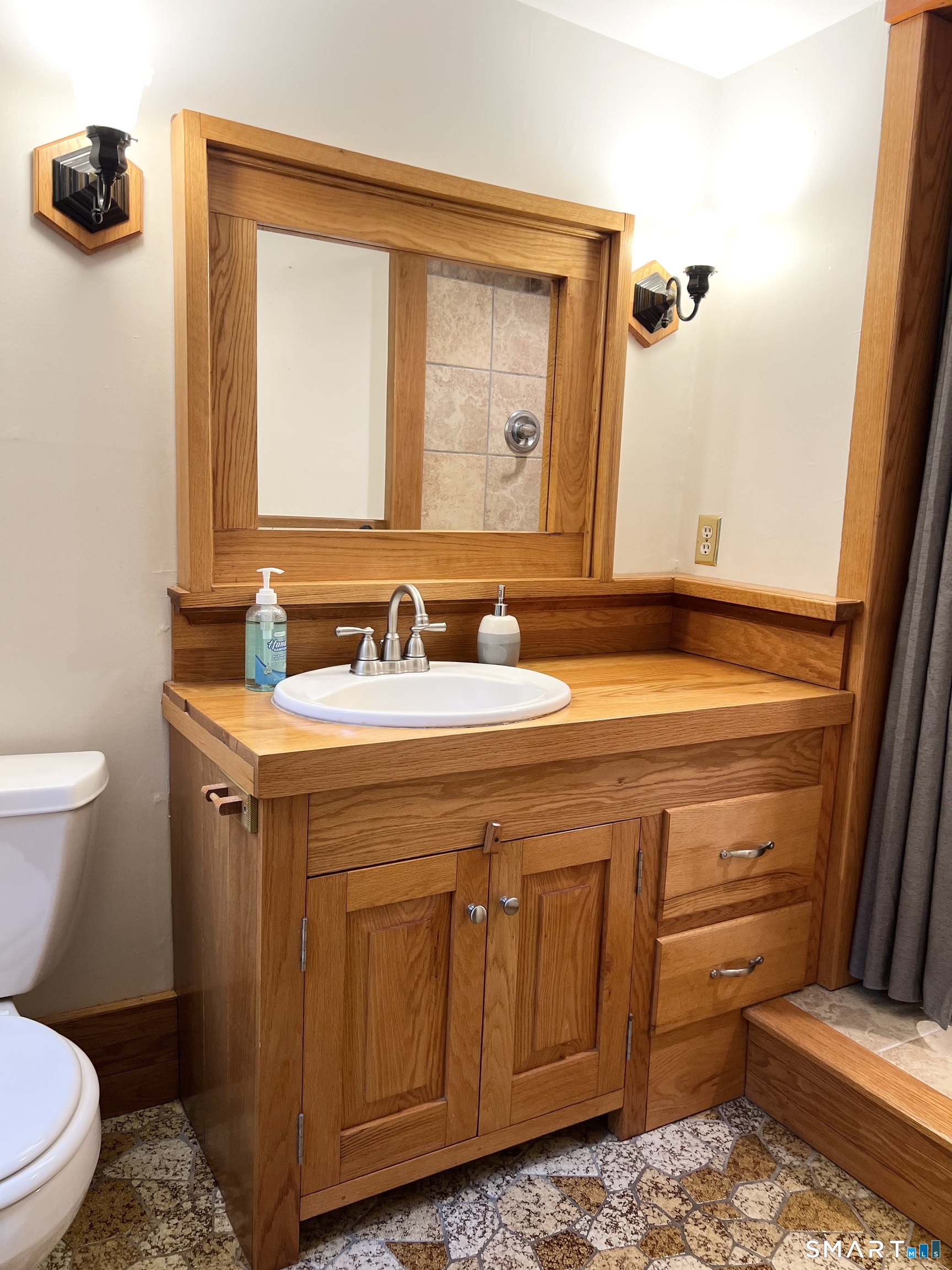 38 Clark Hill Road East Haddam, CT 06423 - Photo 25 of 35 a bathroom with a sink a toilet and mirror