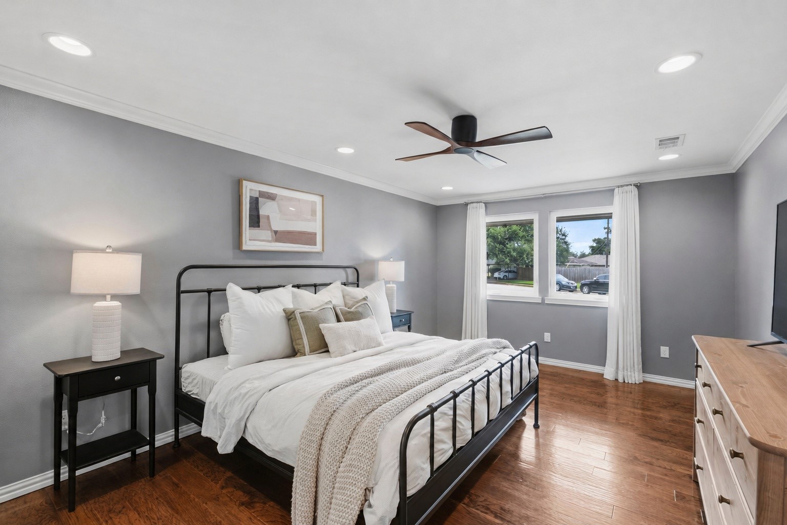4733 Carleen Road Houston, TX 77092 - Photo 11 of 22 The spacious primary suite offers hardwood floors, abundant natural light and crown molding.