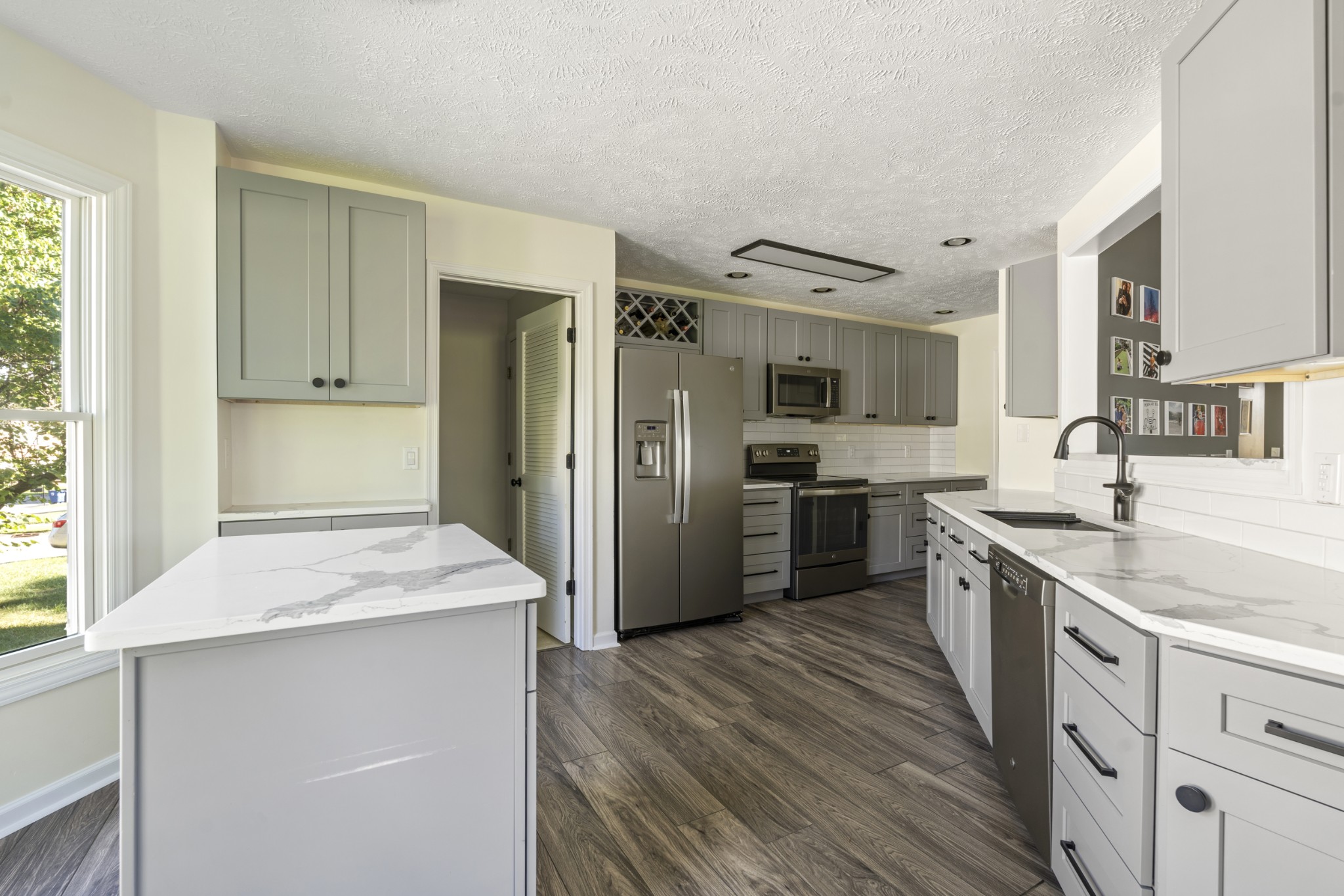 350 Astor Way Franklin, TN 37064 - Photo 12 of 33 a kitchen with stainless steel appliances granite countertop a refrigerator and a sink