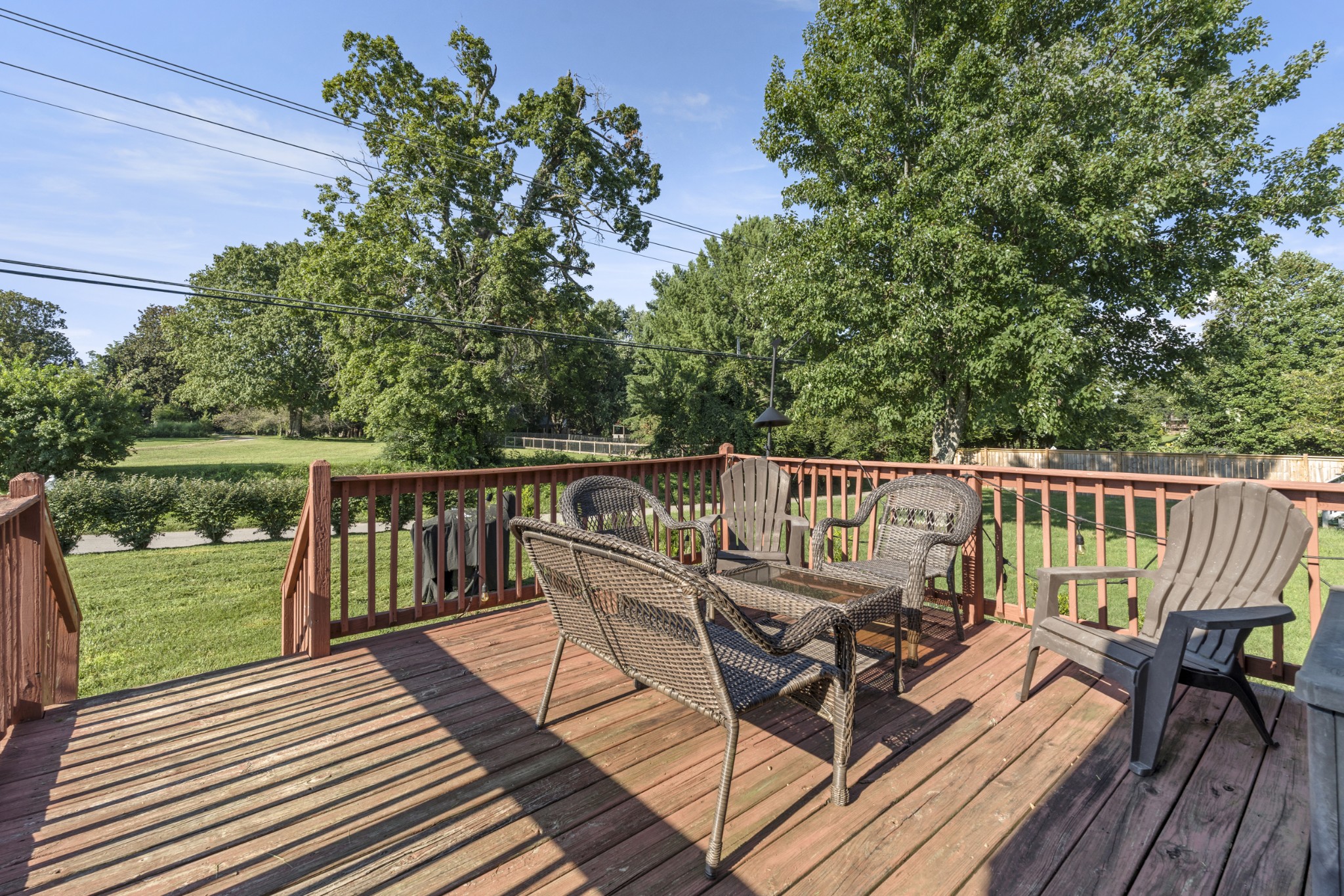 350 Astor Way Franklin, TN 37064 - Photo 27 of 33 a view of a deck with two chairs and wooden floor