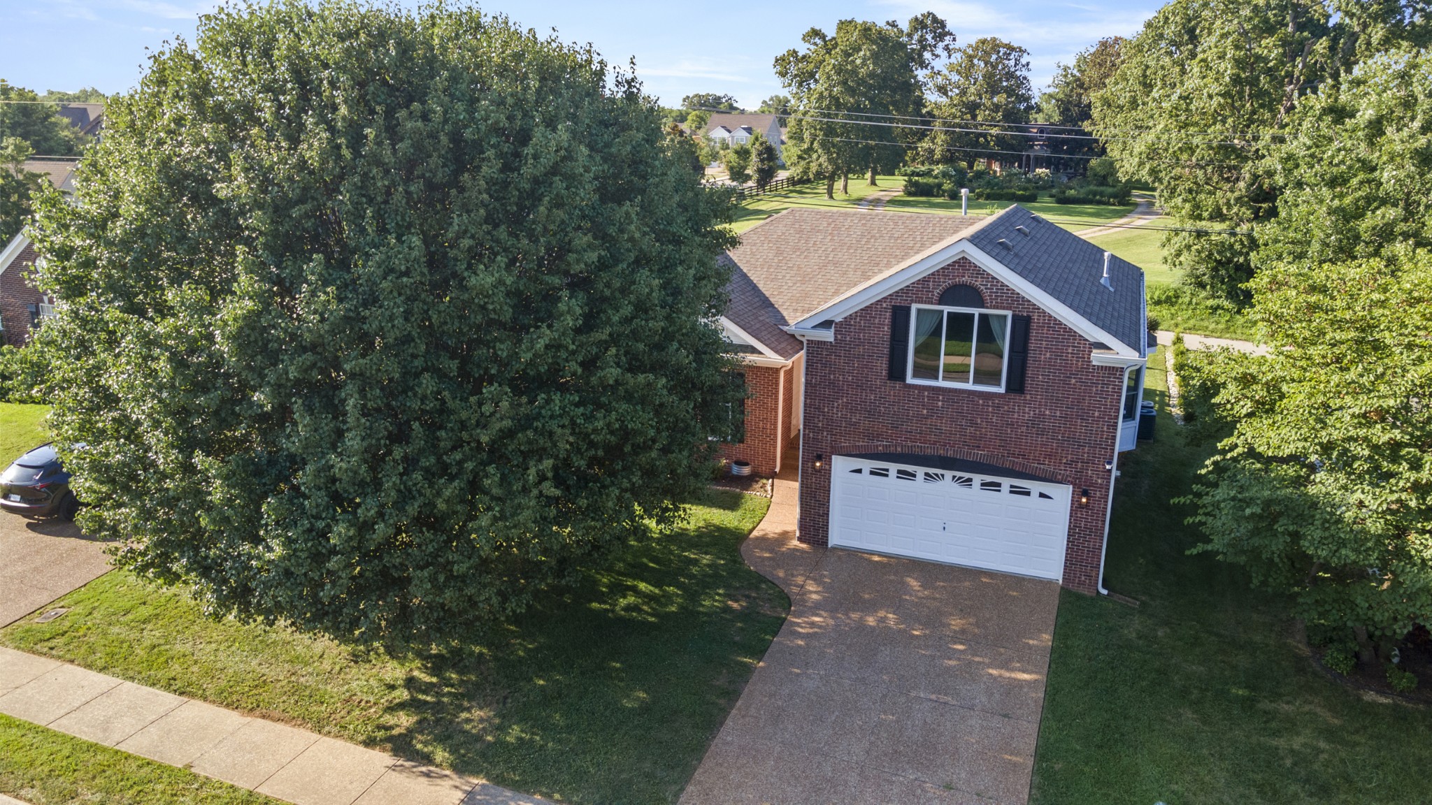 350 Astor Way Franklin, TN 37064 - Photo 30 of 33 a view of a house with a yard and large tree