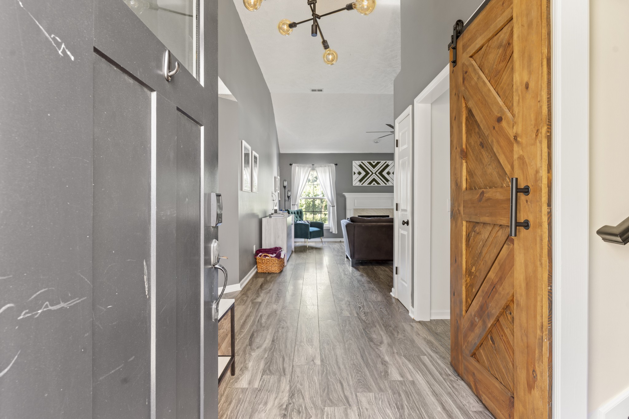 350 Astor Way Franklin, TN 37064 - Photo 4 of 33 a view of a hallway view with wooden floor and staircase