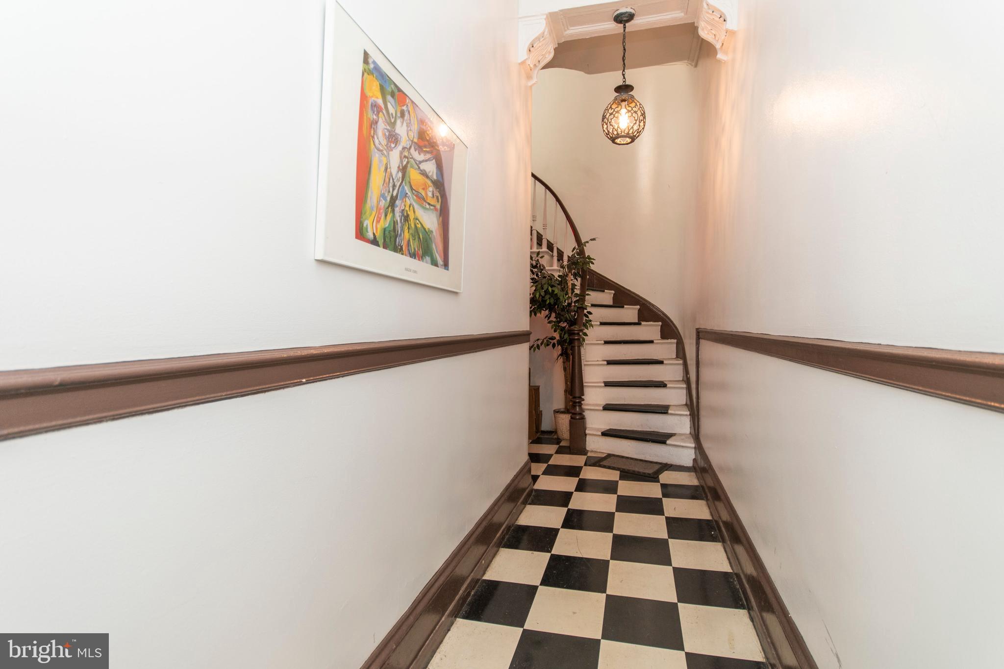 1807 Spruce Street, Unit 1F Philadelphia, PA 19103 - Photo 11 of 12 a view of a hallway with windows and white walls