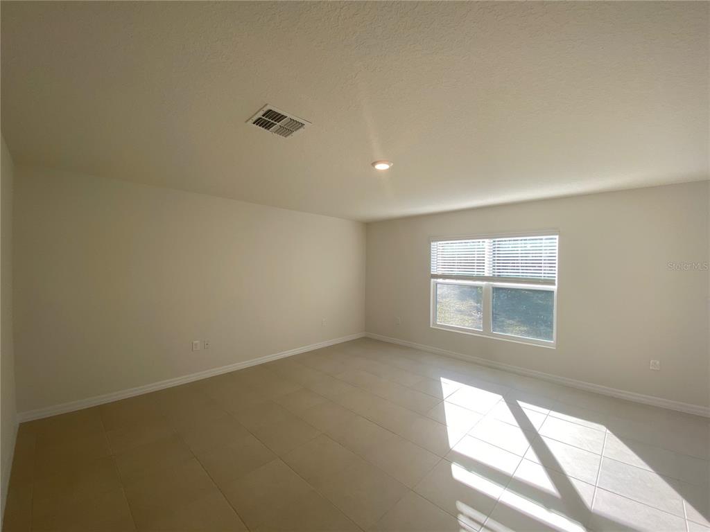308 Hickory Course Radiel Ocala, FL 34472 - Photo 16 of 24 an empty room with windows