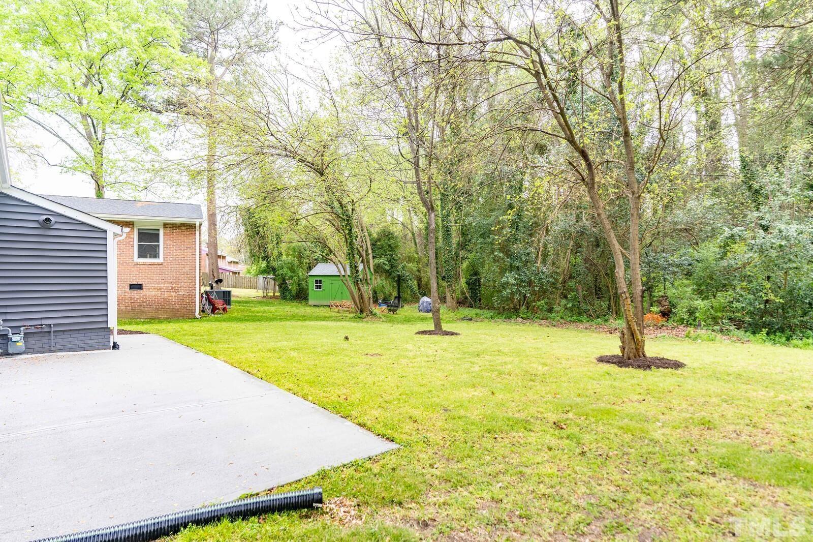 904 Friar Tuck Road Raleigh, NC 27610 - Photo 13 of 13 a view of a yard with swimming pool