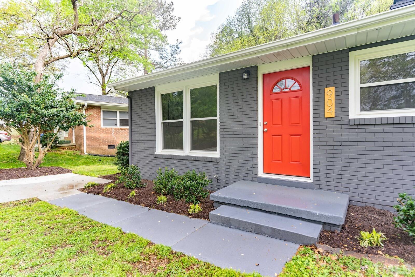 904 Friar Tuck Road Raleigh, NC 27610 - Photo 2 of 13 a front view of a house with garden