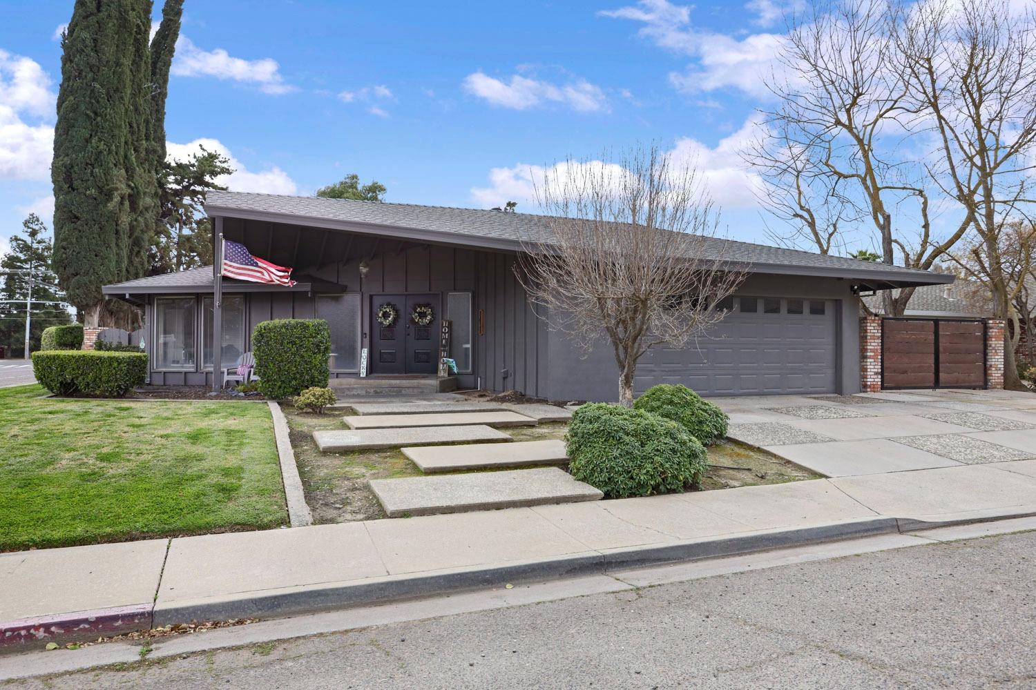 1631 North Johnson Road Turlock, CA 95382 - Photo 2 of 38 front view of a house with a yard