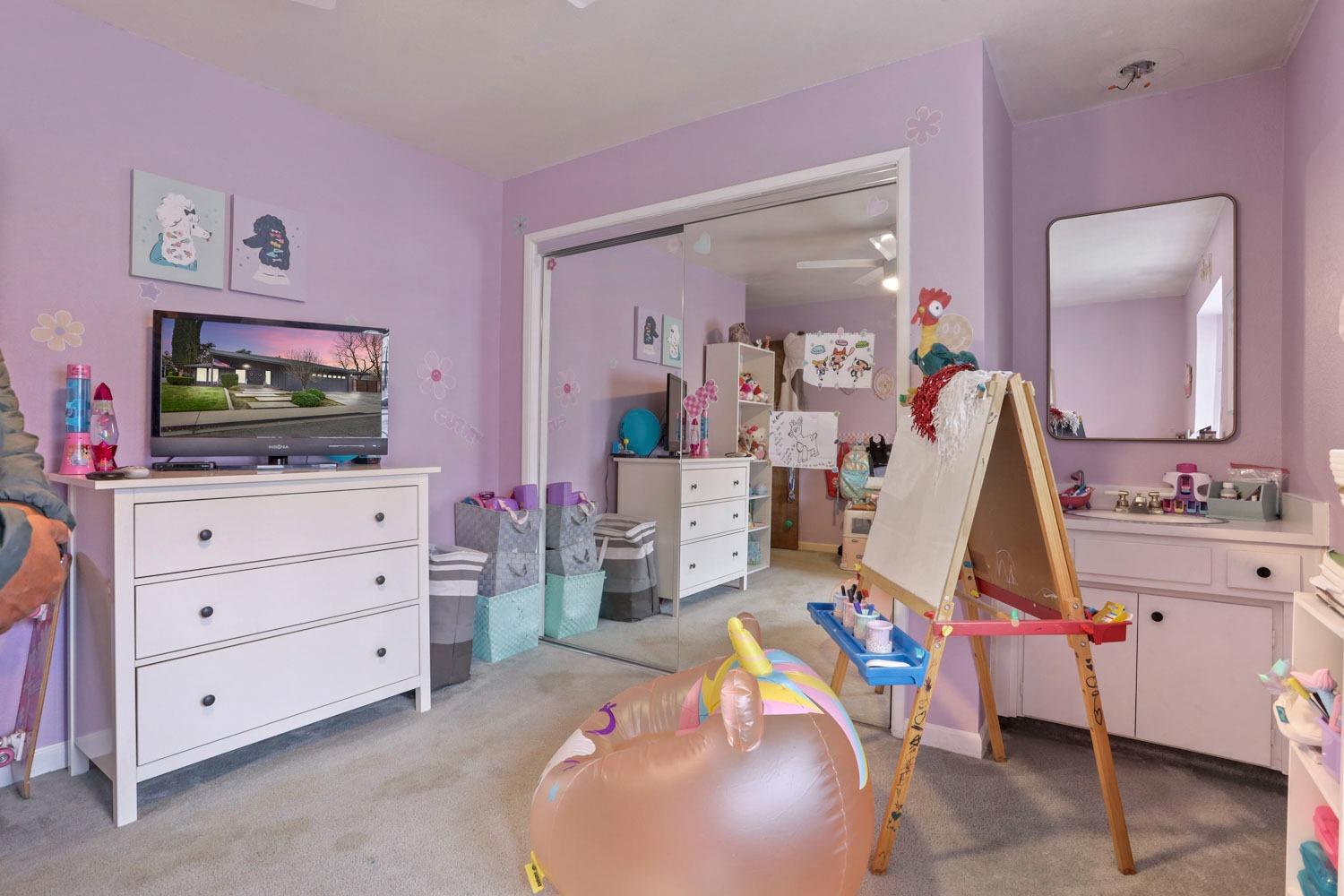 1631 North Johnson Road Turlock, CA 95382 - Photo 22 of 38 a room with furniture and flat screen tv