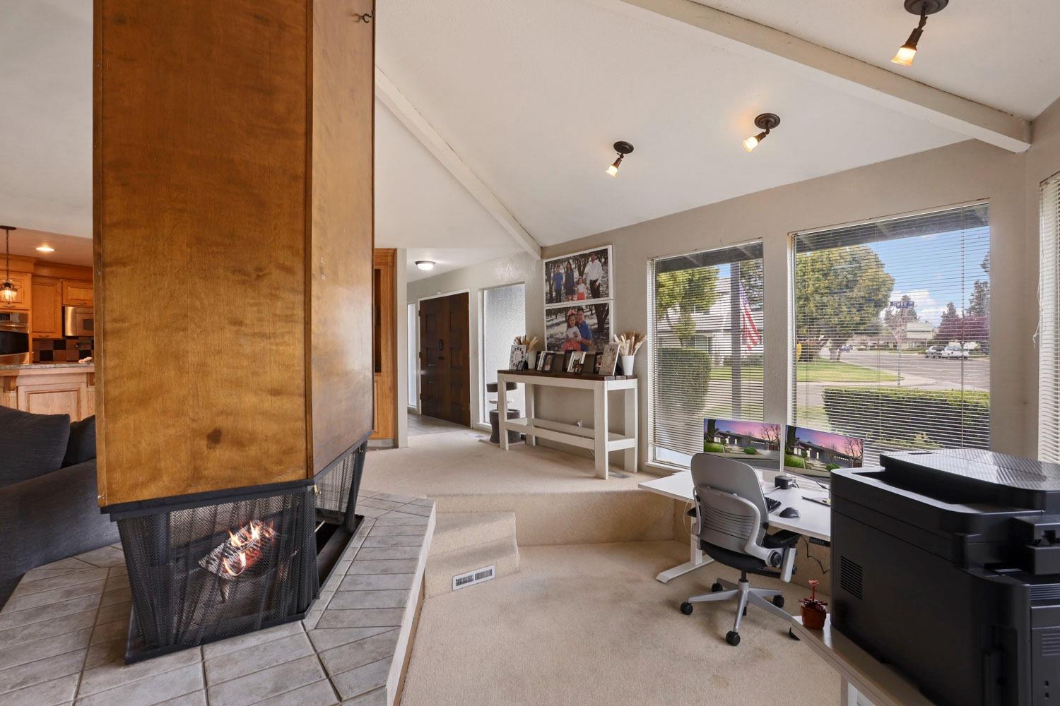1631 North Johnson Road Turlock, CA 95382 - Photo 10 of 38 a view of a livingroom with workspace and a window