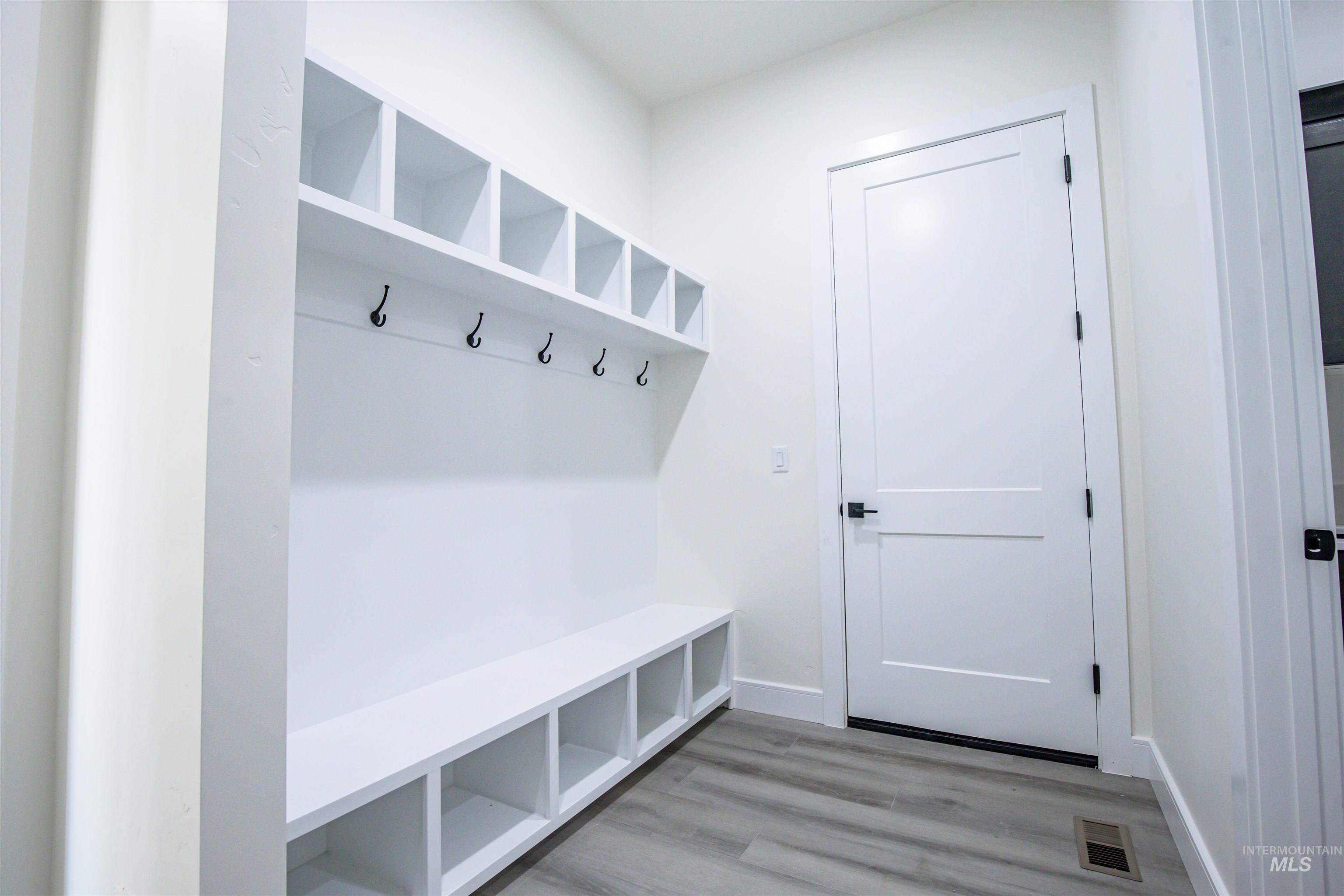 23904 Southview Lane Middleton, ID 83644 - Photo 13 of 29 Built-in mudroom storage featuring a bench, cubbies, and coat hooks