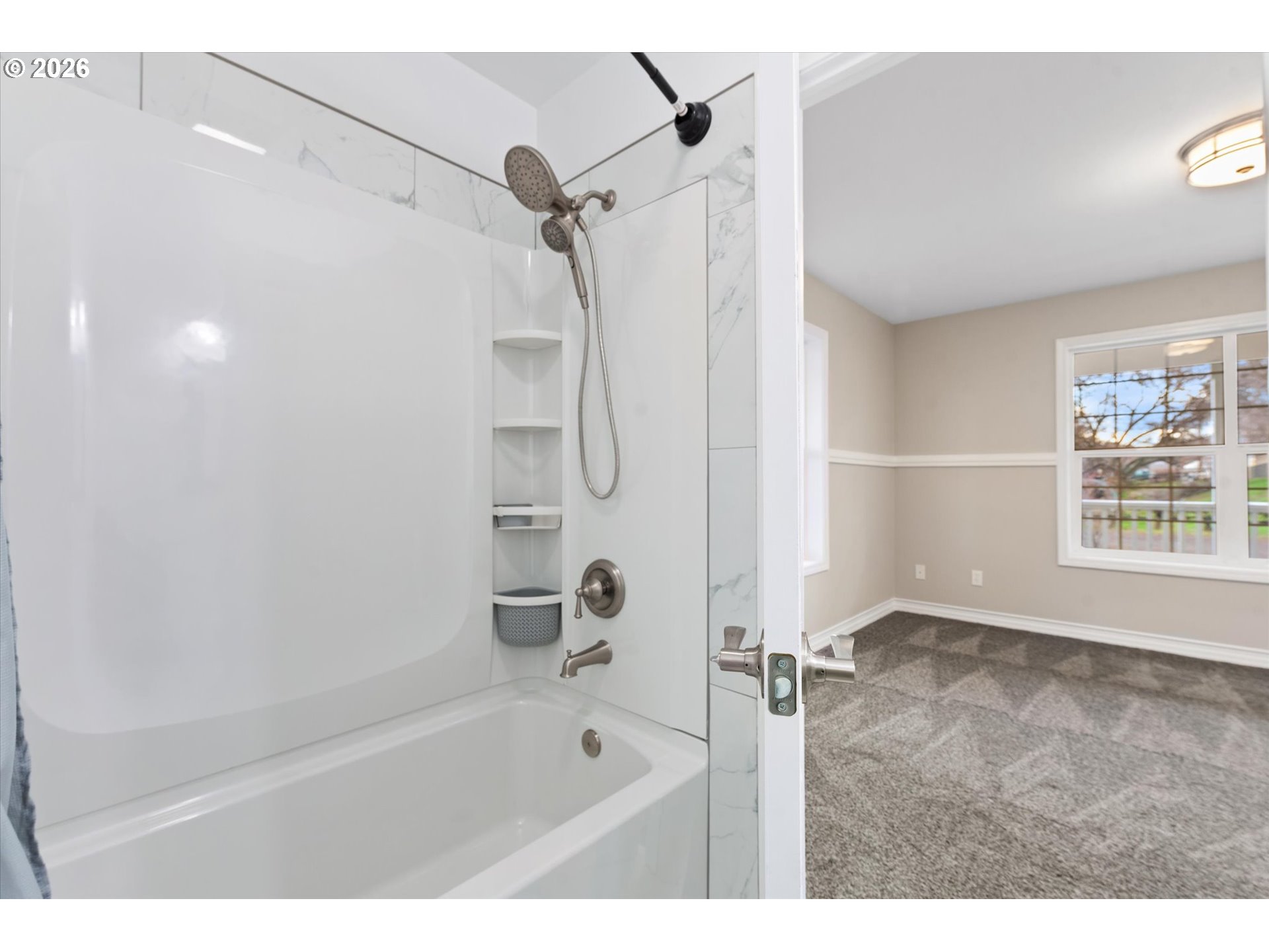 10 West Sprague Echo, OR 97826 - Photo 12 of 45 a bathroom with a bathtub and a shower