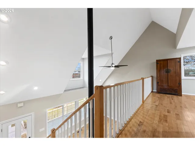 a view of a hallway with stairs