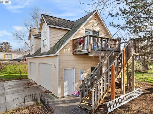 a view of front door of house with stairs